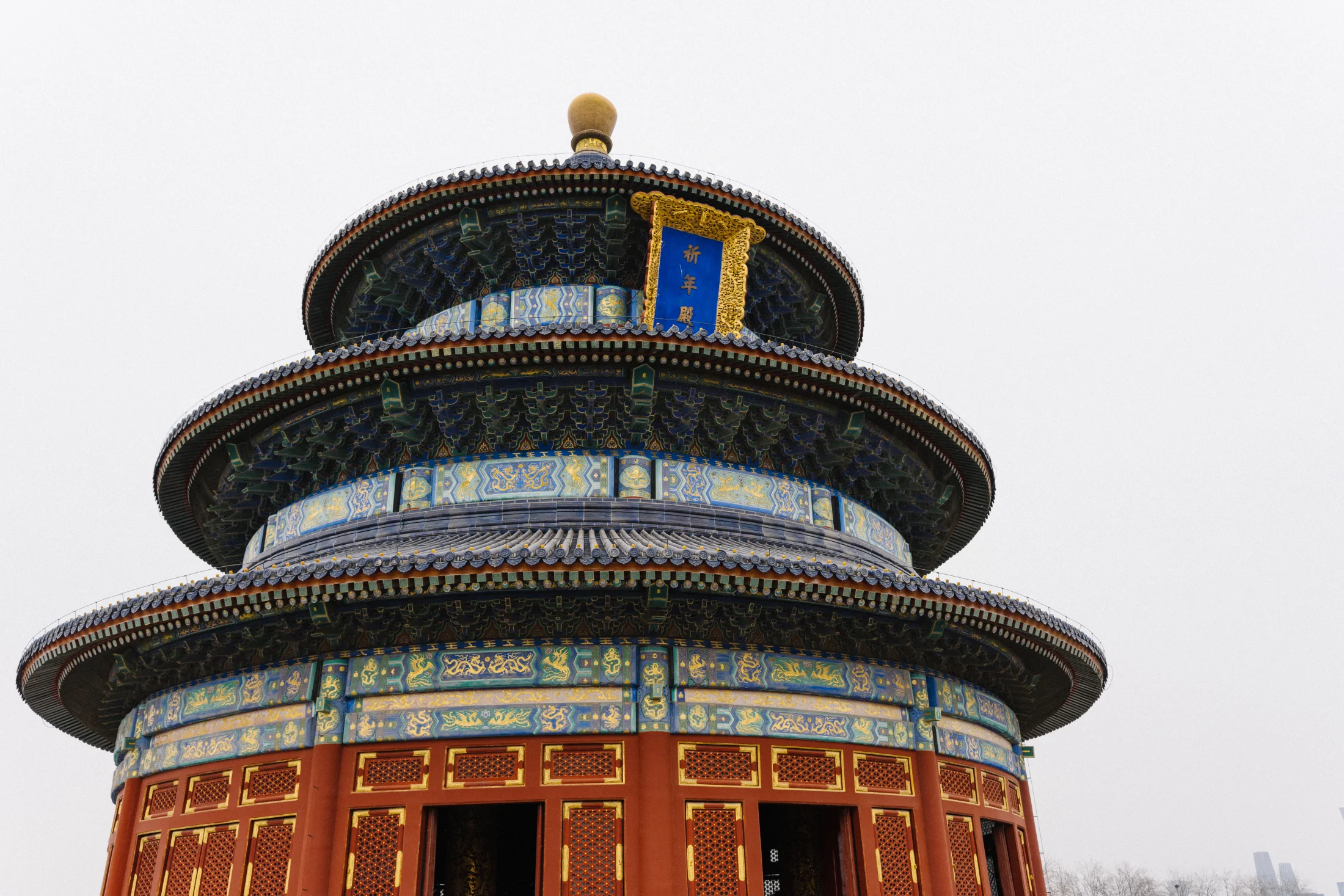 The Hall of Prayer for Good Harvests rises above red balustrades in clear winter daylight.