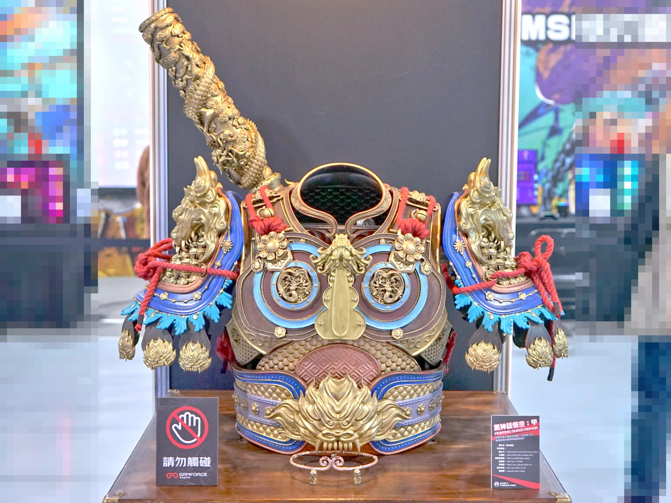 A highly detailed physical replica of Black Myth Wukong's Suozi armour is displayed at a computer and gaming exhibition.